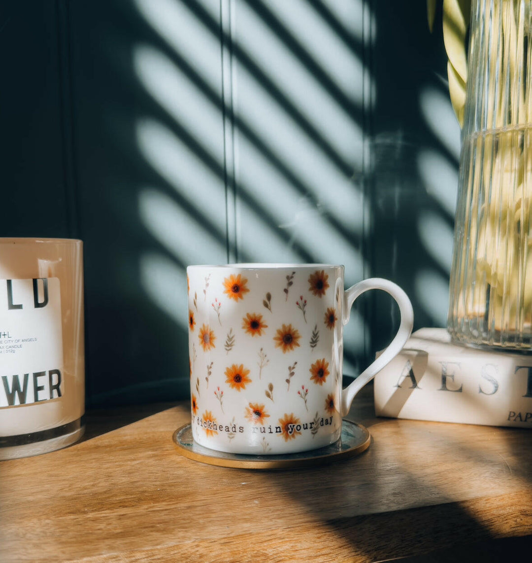 Sunflower illustrated bone china mug that says 'don't let any dickheads ruin your day'