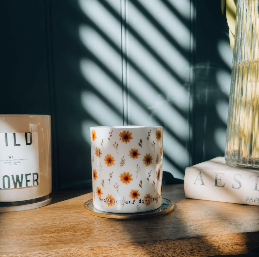 Sunflower illustrated bone china mug that says 'don't let any dickheads ruin your day'